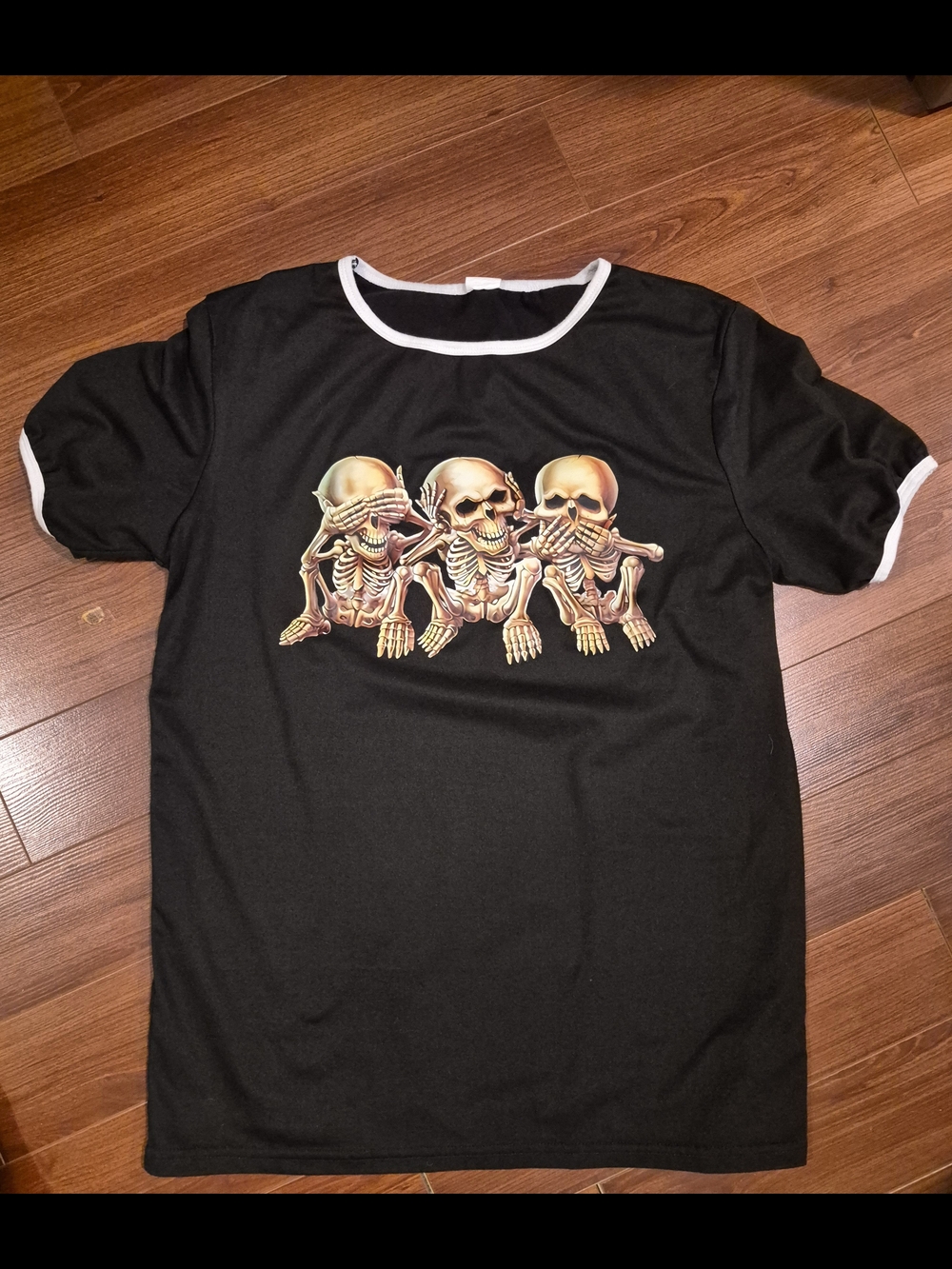 Black Ringer Tee with Three Skull Graphic